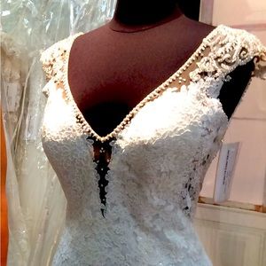 Casablanca wedding dress. professionally cleaned and vacuumed sealed in box.